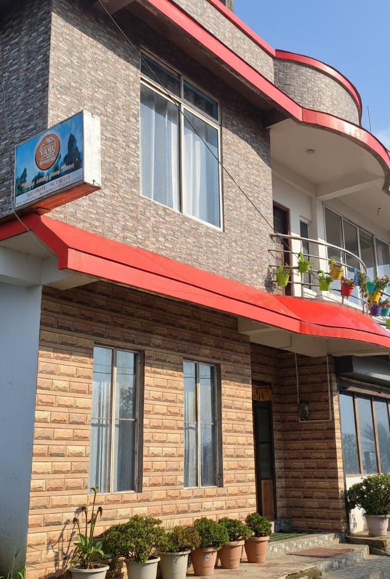 Front porch and seating area at Majhidhura Homestay